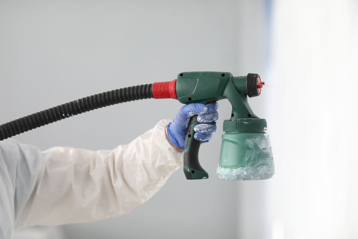 Spray gun painting a wall in a San Ramon, CA area painting project